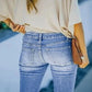 Jeans vintage anni '90 con bottoni in vita e gamba svasata